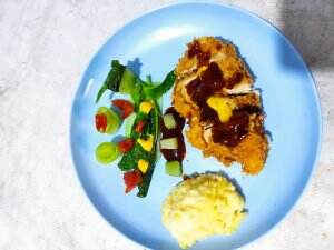 chiken katsu infused with Indonesian herbs, creamy mash potato and green salad