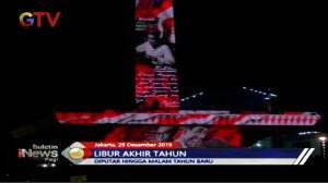 Masuki Libur Akhir Tahun, Warga Jakarta Beramai Saksikan Video Maping di Tugu Monas