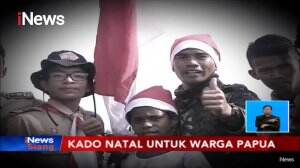 Bersukacita! Para Penerjun Bagikan Kado Natal kepada Warga di Timika, Papua