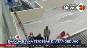 WNA Terjebak Di Atas Gedung