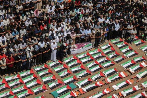 Warga Gaza Gelar Pemakaman Massal 112 Orang yang Tewas Diserang Israel pada 2023 Warga Gaza Gelar Pemakaman Massal 112 Orang yang Tewas Diserang Israel pada 2023