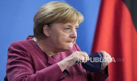 Permen Berbentuk Wajah Merkel Jadi Suvenir Perpisahan