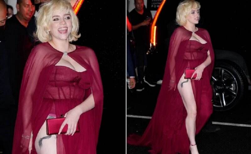 Pakai Gaun Merah Super Seksi, Billie Eilish Pamer Tato di Paha